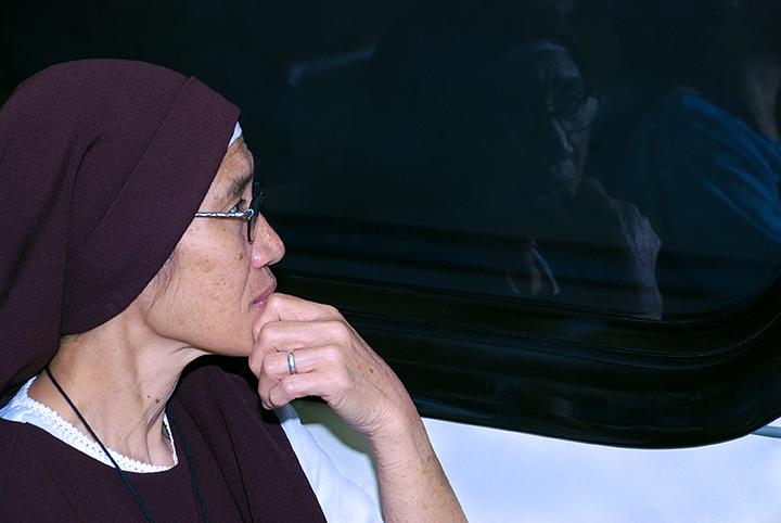 Nun In Self Reflection